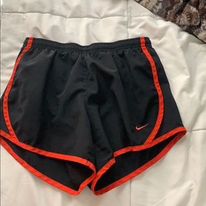 Red and black Nike wind shorts